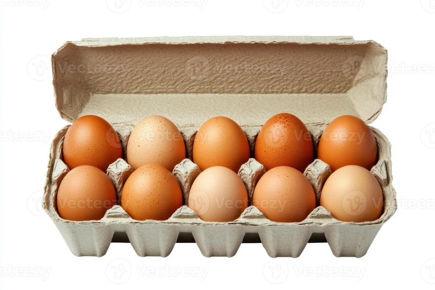 An open egg box containing ten brown eggs is isolated on a white background, emphasizing fresh organic chicken eggs stored in a carton pack with ample copy space provided. photo