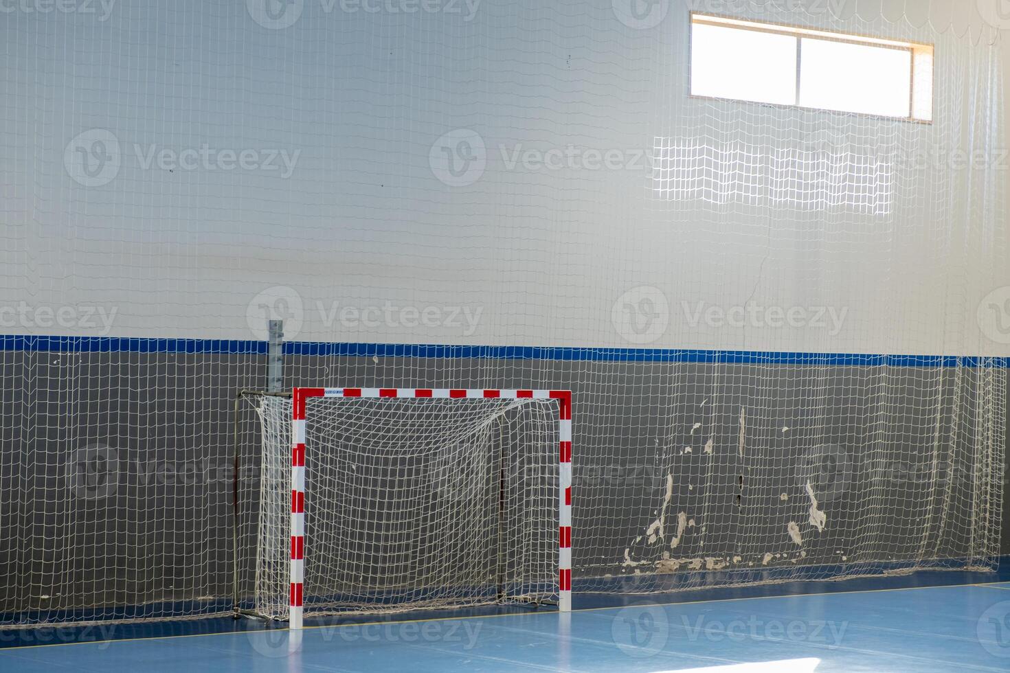 Gym for playing futsal, mini-football. Interior of a sport hall for soccer or handball photo