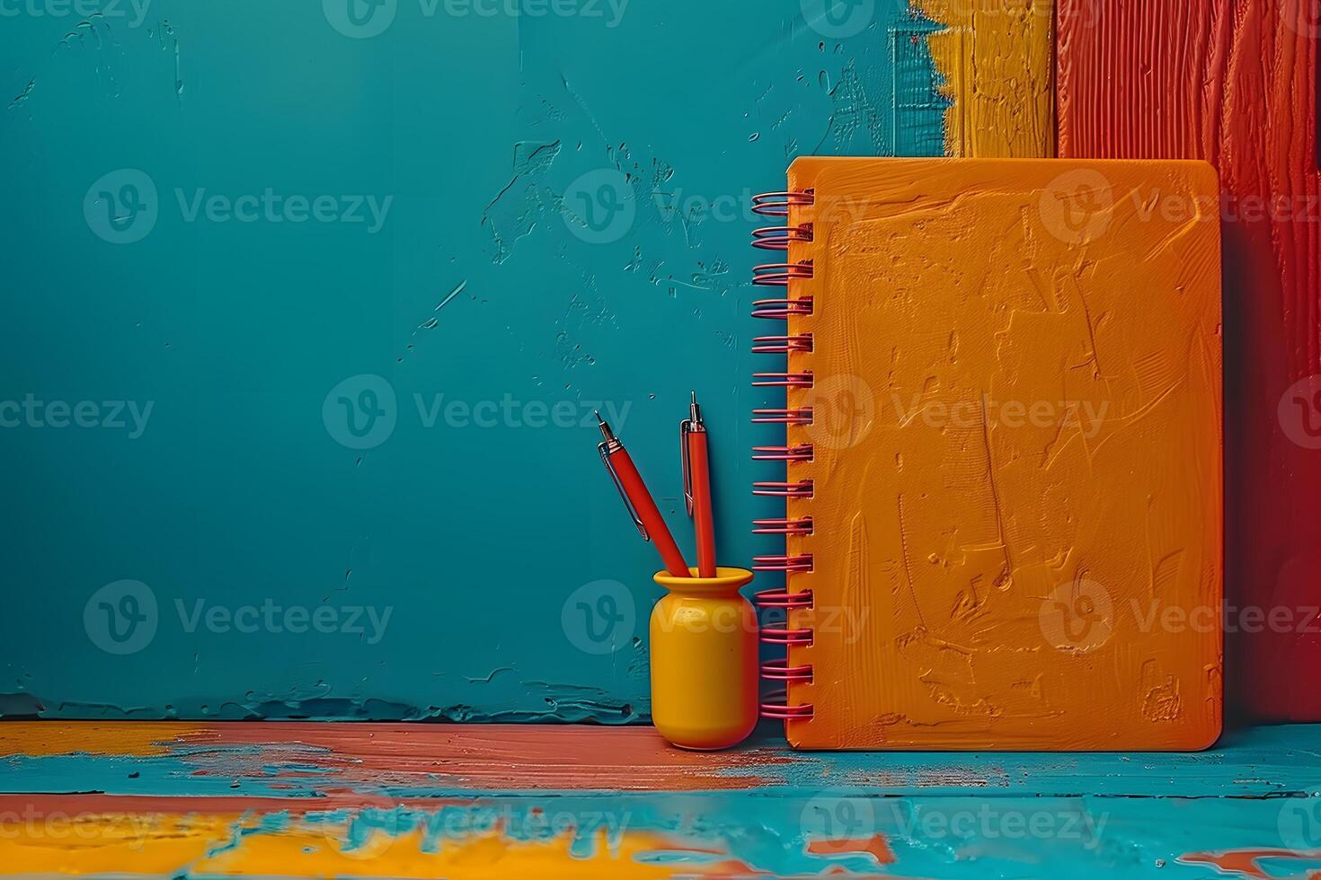 Colorful Artistic Workspace with Painted Notebook and Pen Holder - Creative Desk Supplies for Artistic Creations photo