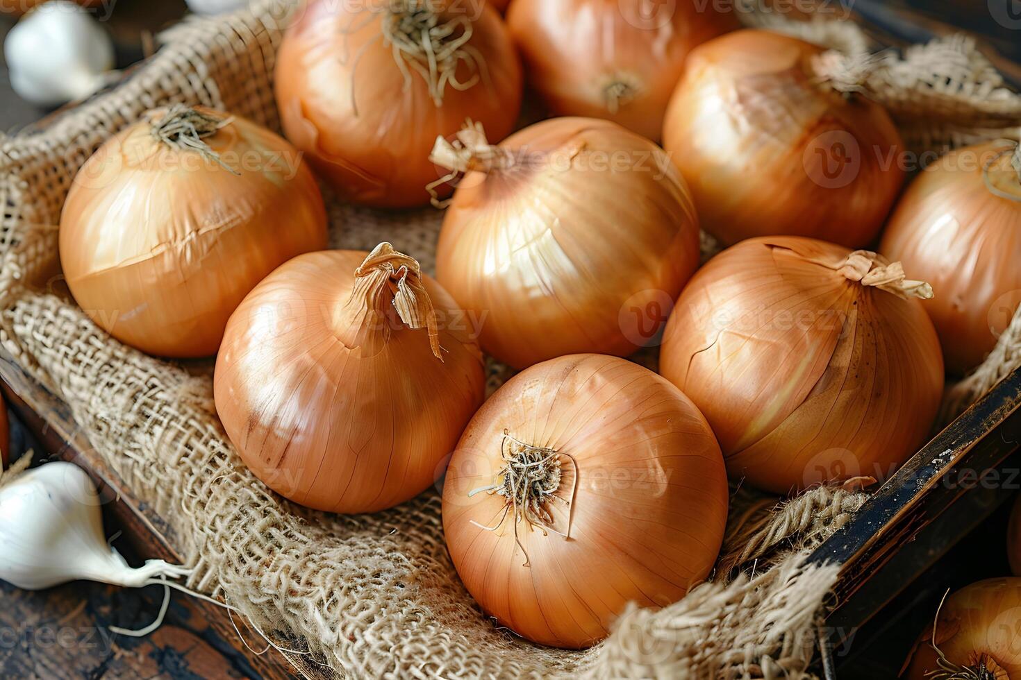 Fresh Yellow Onions in a Rustic Wooden Crate on Burlap - Organic Farming and Culinary Ingredient photo