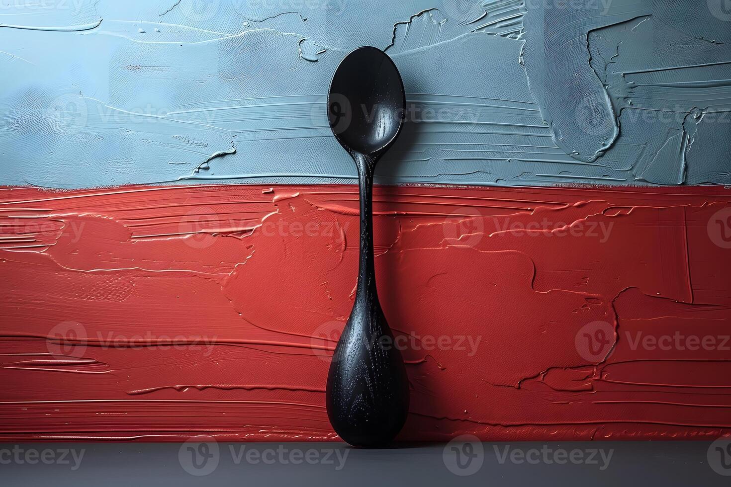 Abstract Black Spoon Against a Textured Red and Blue Background - Modern Kitchen Art photo