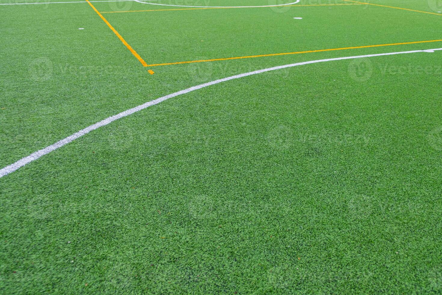partial view of the center circle of an artificial turf soccer field photo