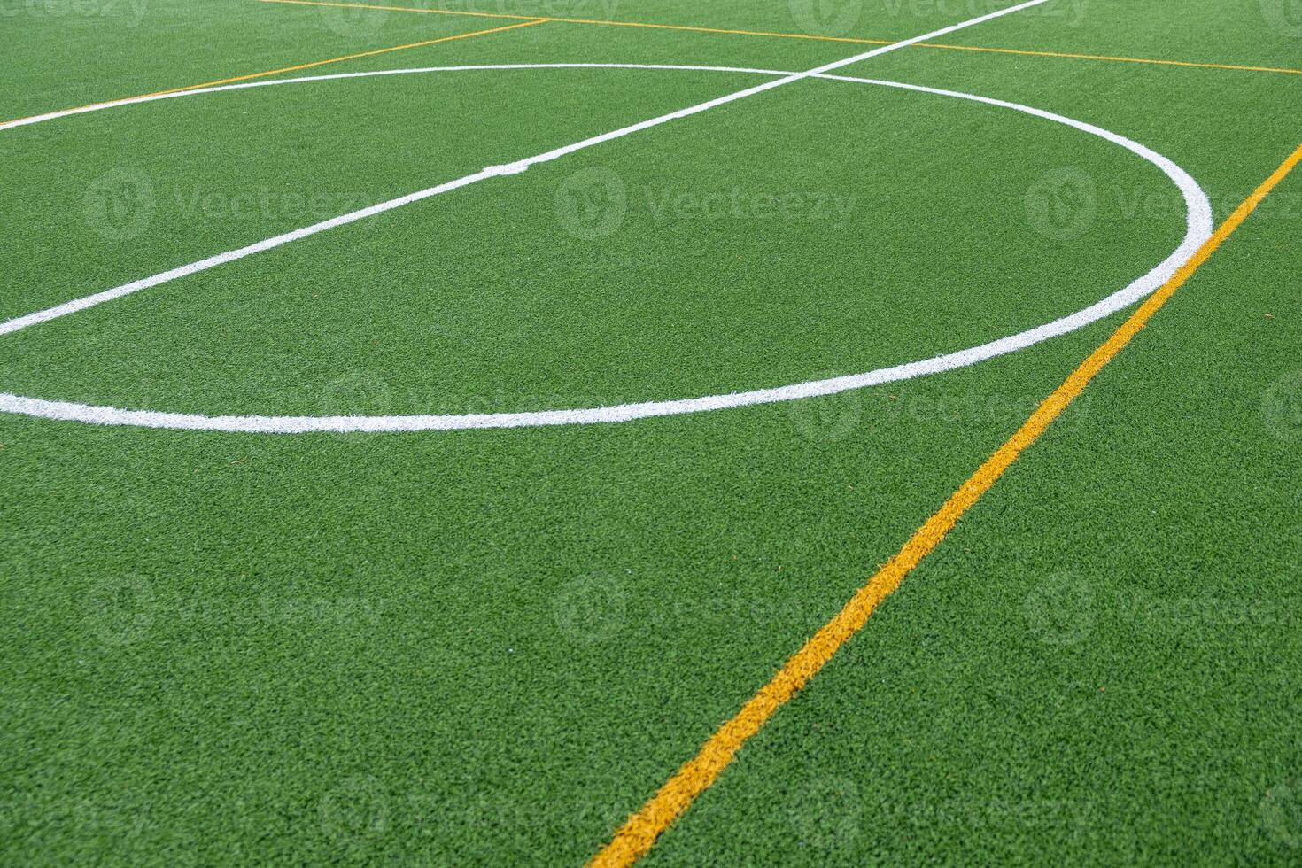 Detail of the center of an artificial grass 7-a-side football field. photo