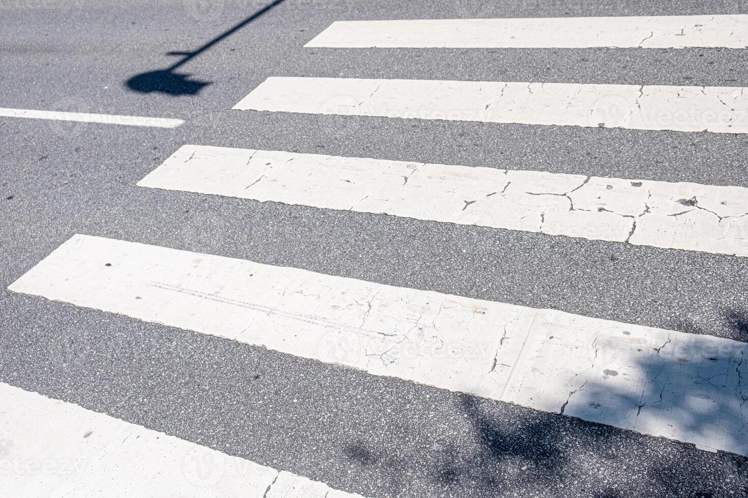 pedestrian crosswalk painted on the asphalt of a street photo