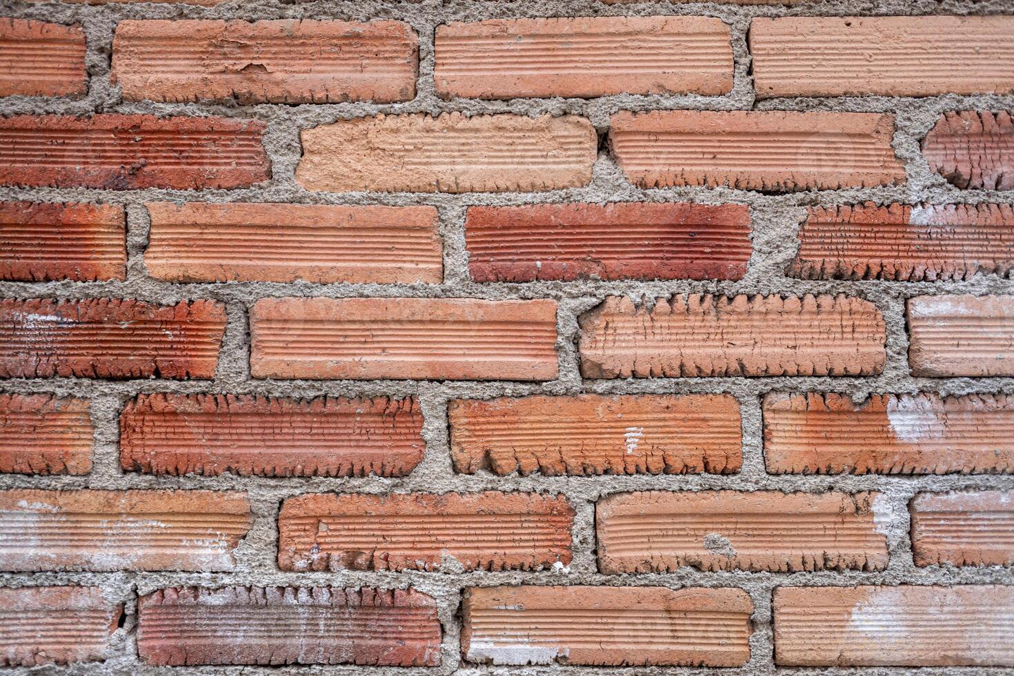 detail of an old brick wall, construction texture background photo