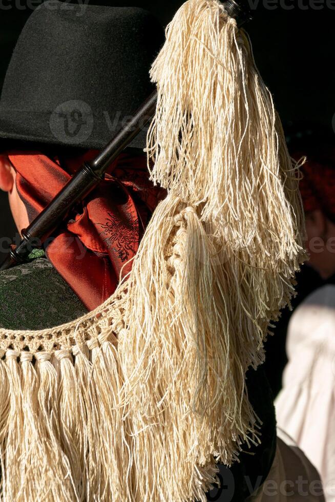 a bagpiper in a traditional folk music band in Galicia. the instruments are bagpipes, drums and bass drums. photo