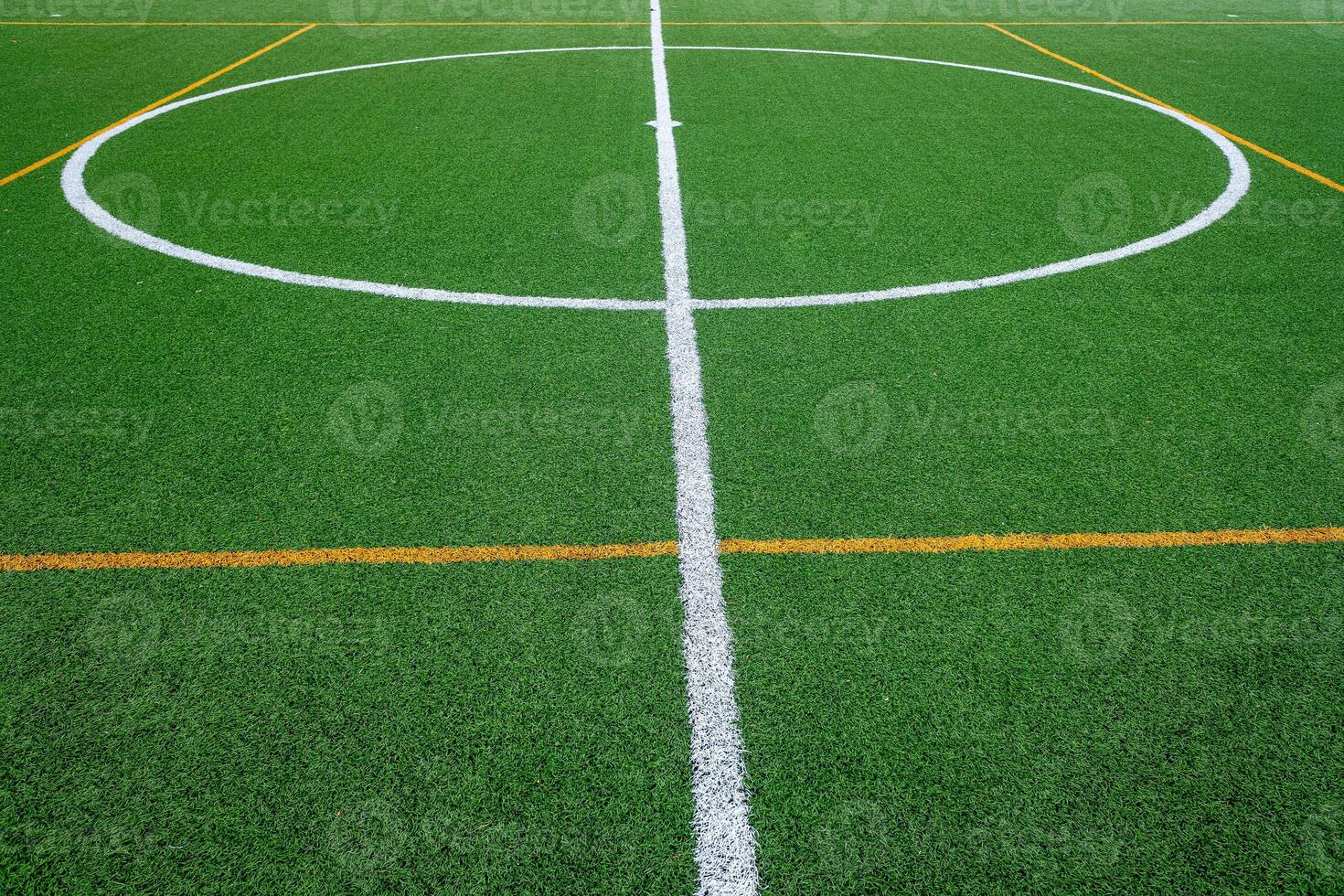 detail of the surface of an artificial grass soccer field photo