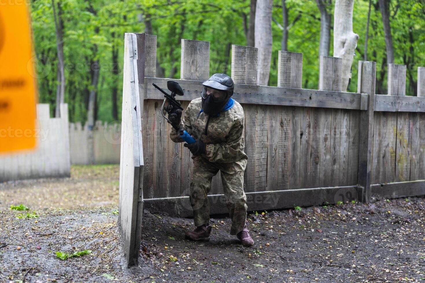 kids team play paintball on the field photo