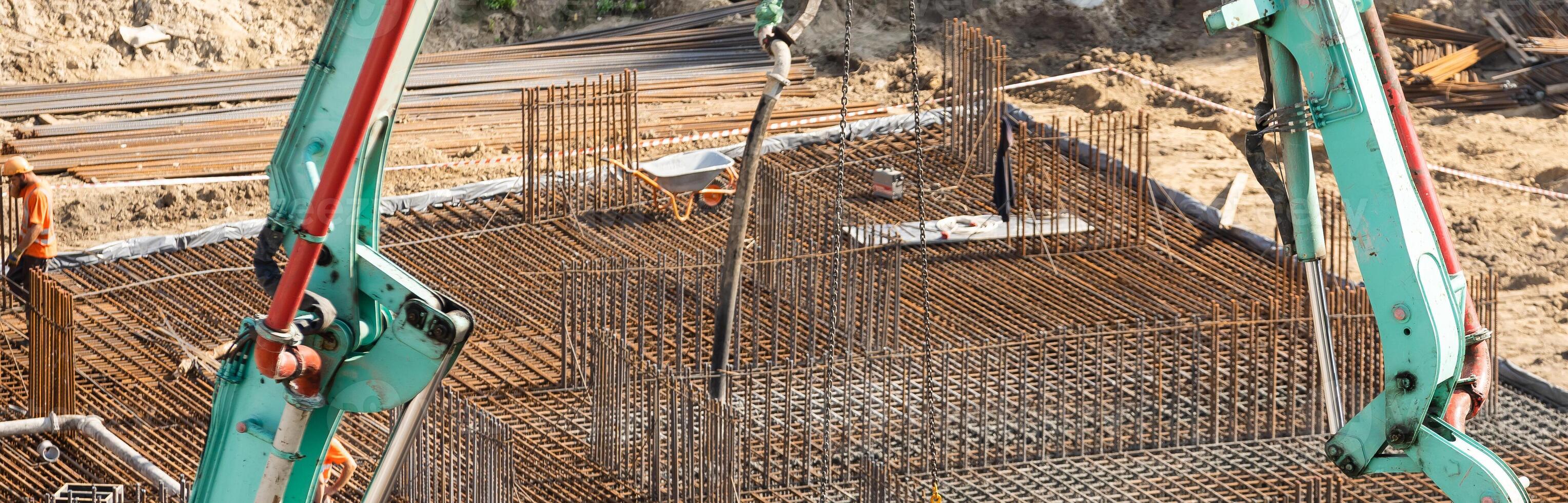 workers working with concrete irons in a construction site photo