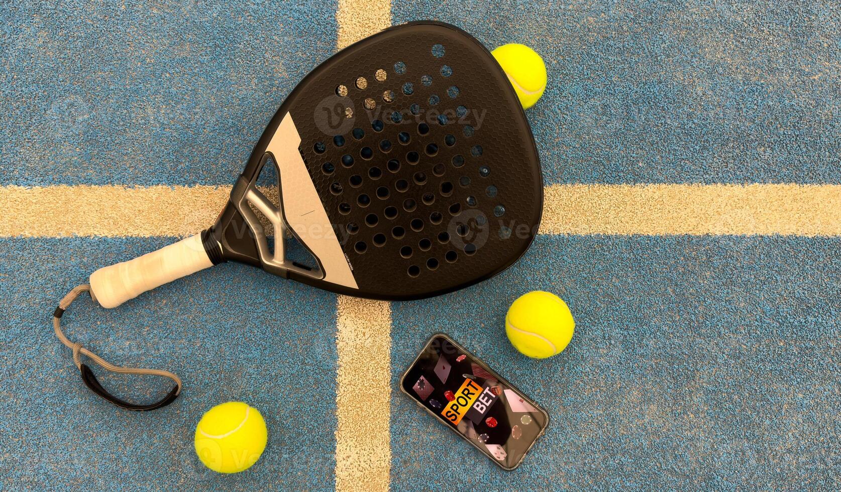paddel racket and smartphone with bet background photo