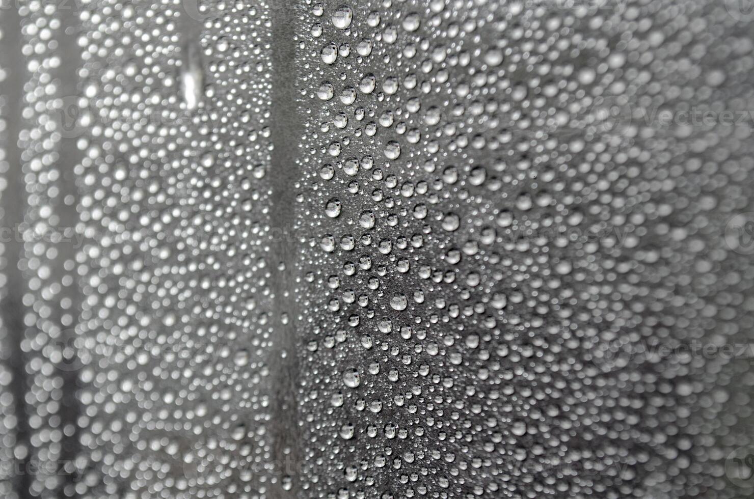 Water droplets on dark cover background after raining day photo