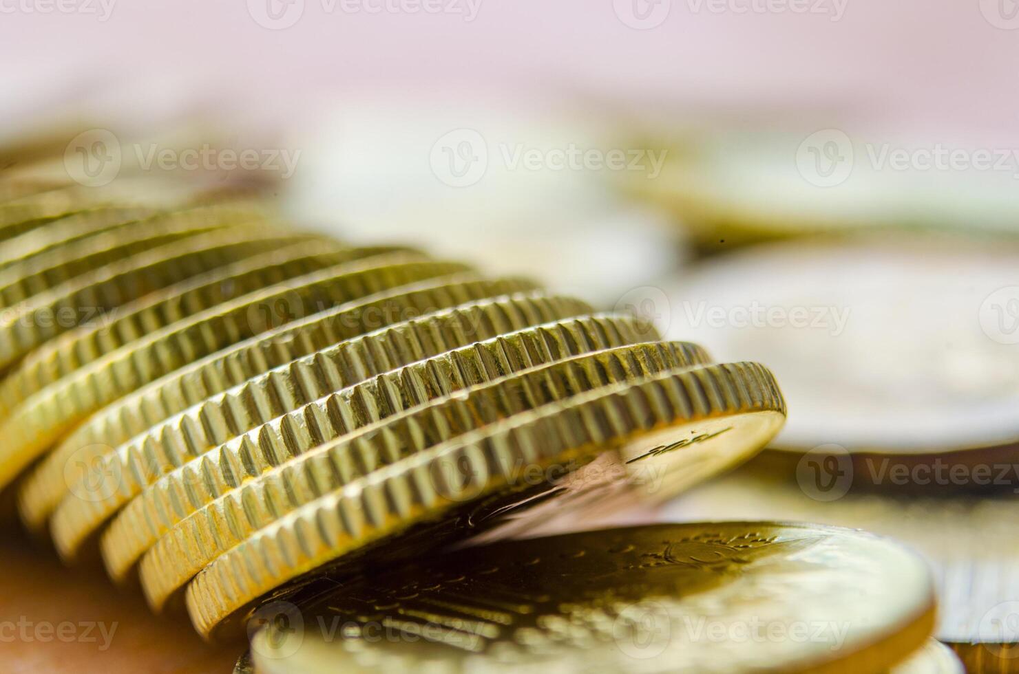 Close up of side view of golden coins. This is suitable banking, wealth and business concept photo