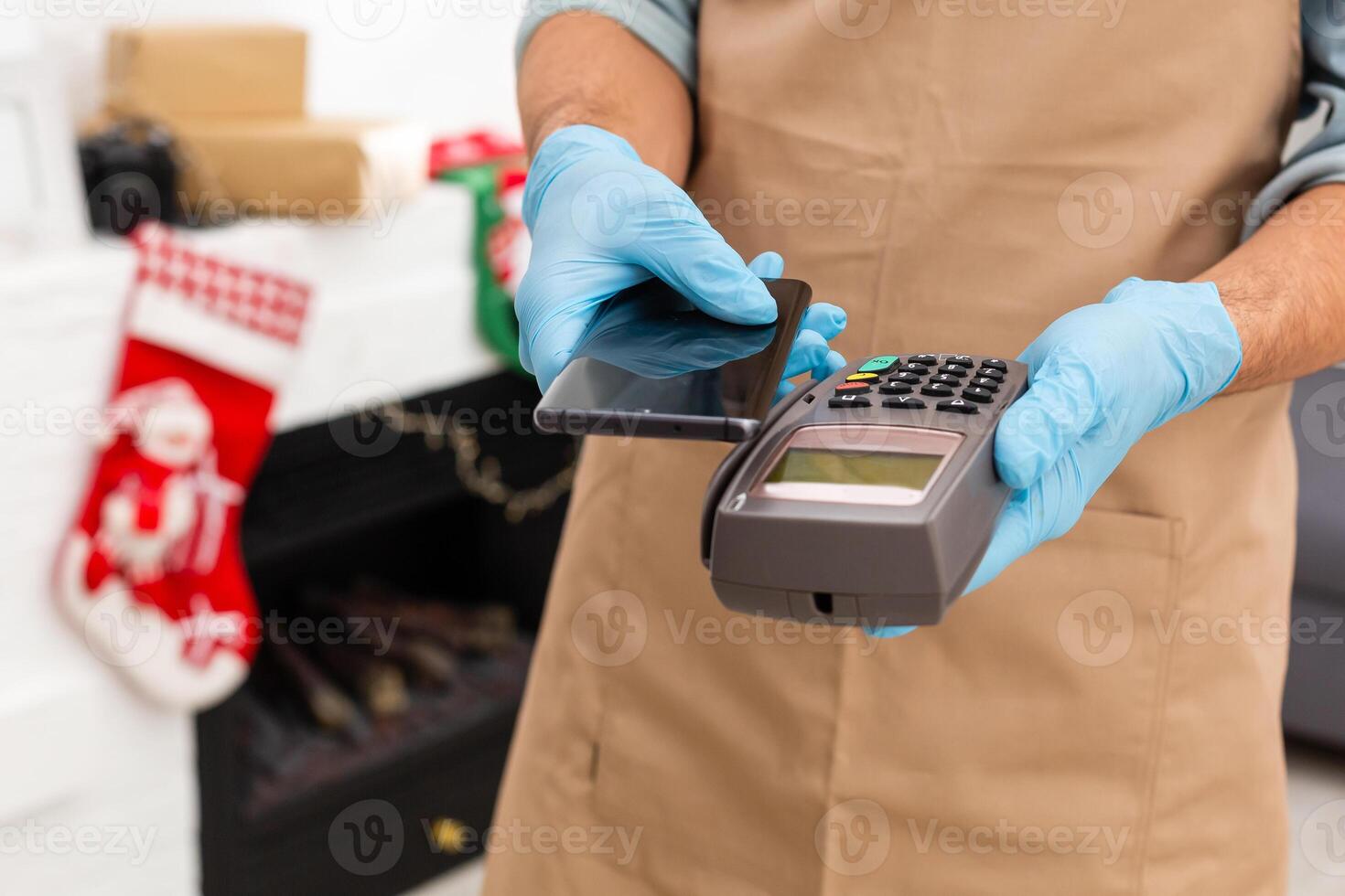 Payment on a trade through contactless card and NFC technology. Front view. Horizontal composition. photo