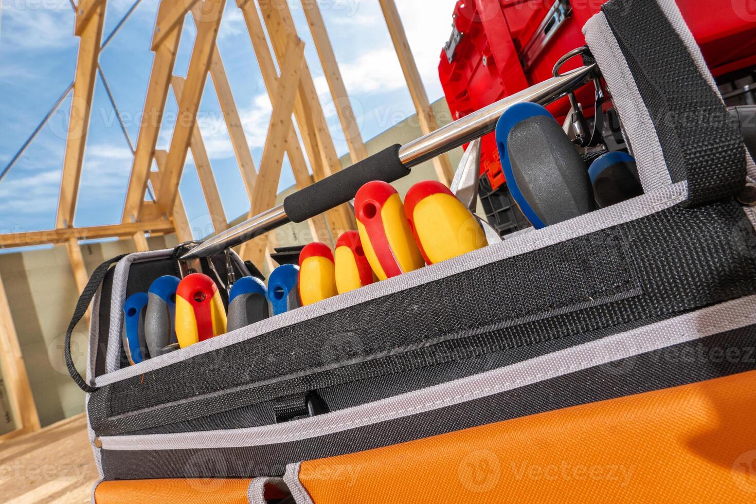 Colorful Tools Arranged Neatly in a Toolbox at a Construction Site on a Sunny Day photo