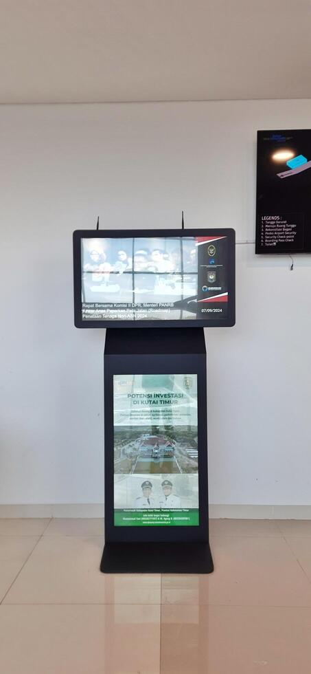 Atmosphere and view of passengers activity at Sultan Hasanuddin International airport terminal. Makassar, South Sulawesi, Indonesia - September 7 2024 photo