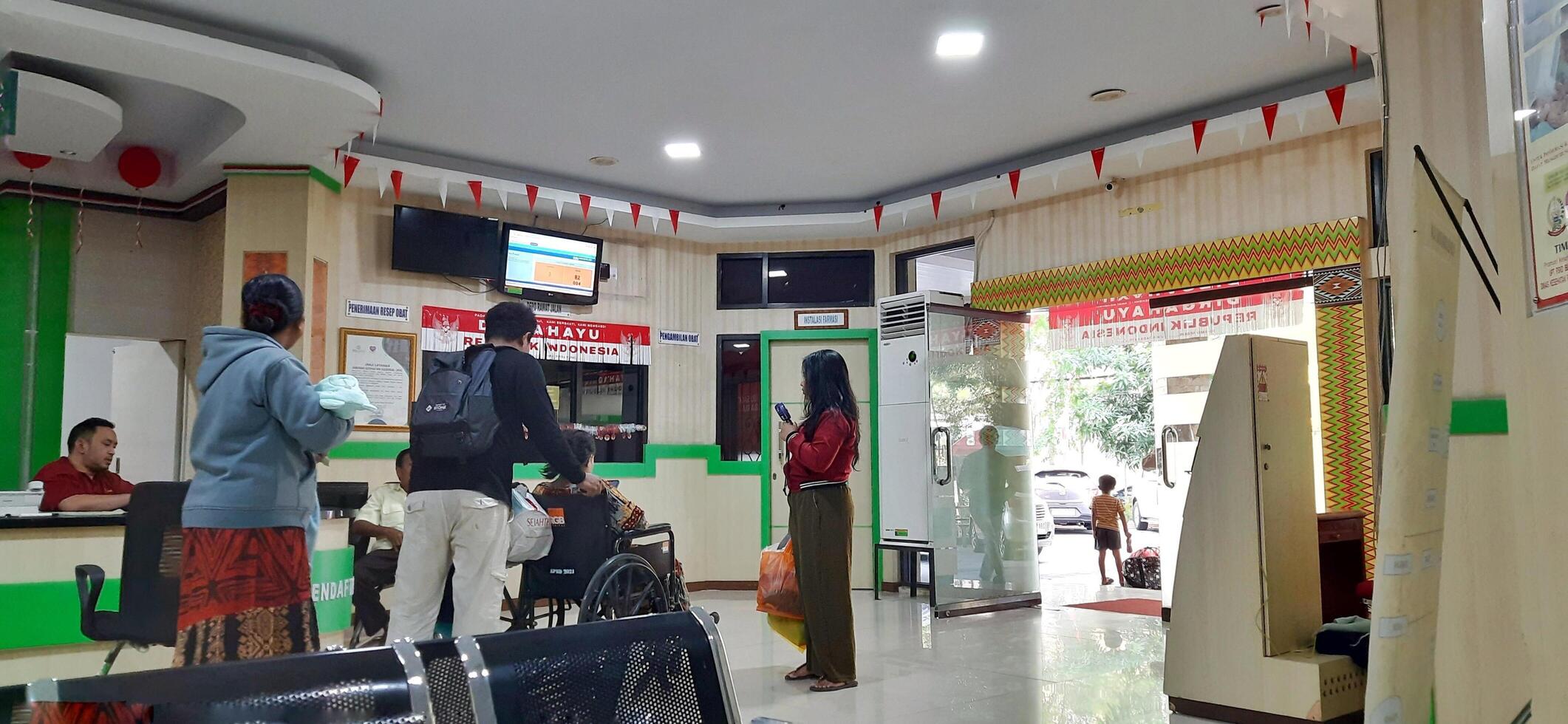The atmosphere in lobby hospital. Patient waiting to receive medical services. Makassar, South Sulawesi, Indonesia - September 1 2024 photo