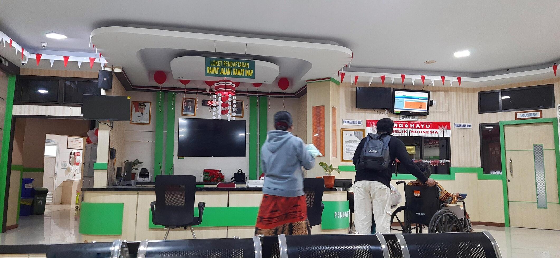 The atmosphere in lobby hospital. Patient waiting to receive medical services. Makassar, South Sulawesi, Indonesia - September 1 2024 photo
