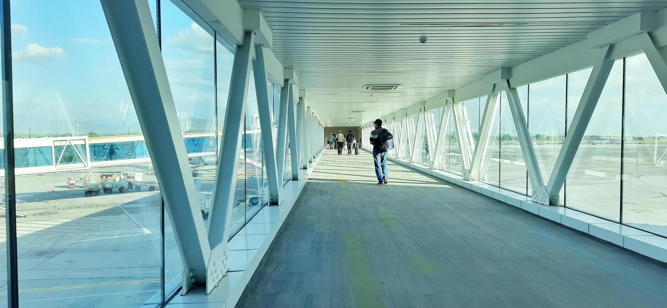 Atmosphere and view of passengers activity at Sultan Hasanuddin International airport terminal. Makassar, South Sulawesi, Indonesia - September 7 2024 photo
