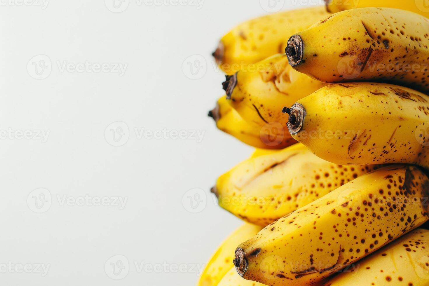 A bunch of bananas are sitting on top of each other photo