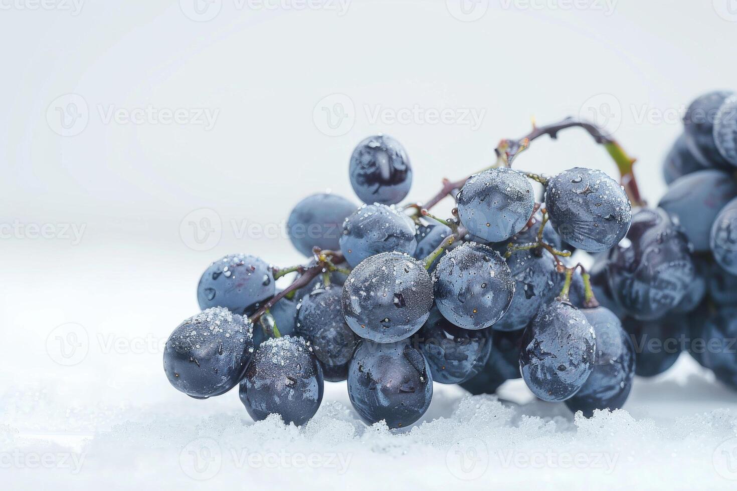 A bunch of grapes sitting on top of snow photo