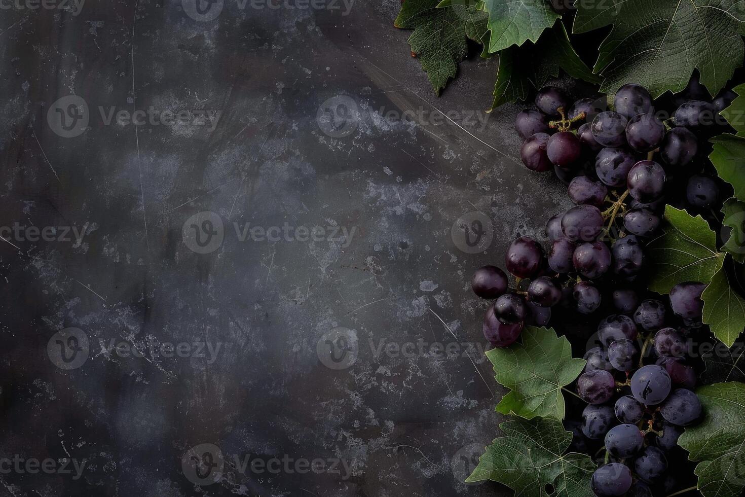 Grapes on a dark background with leaves photo