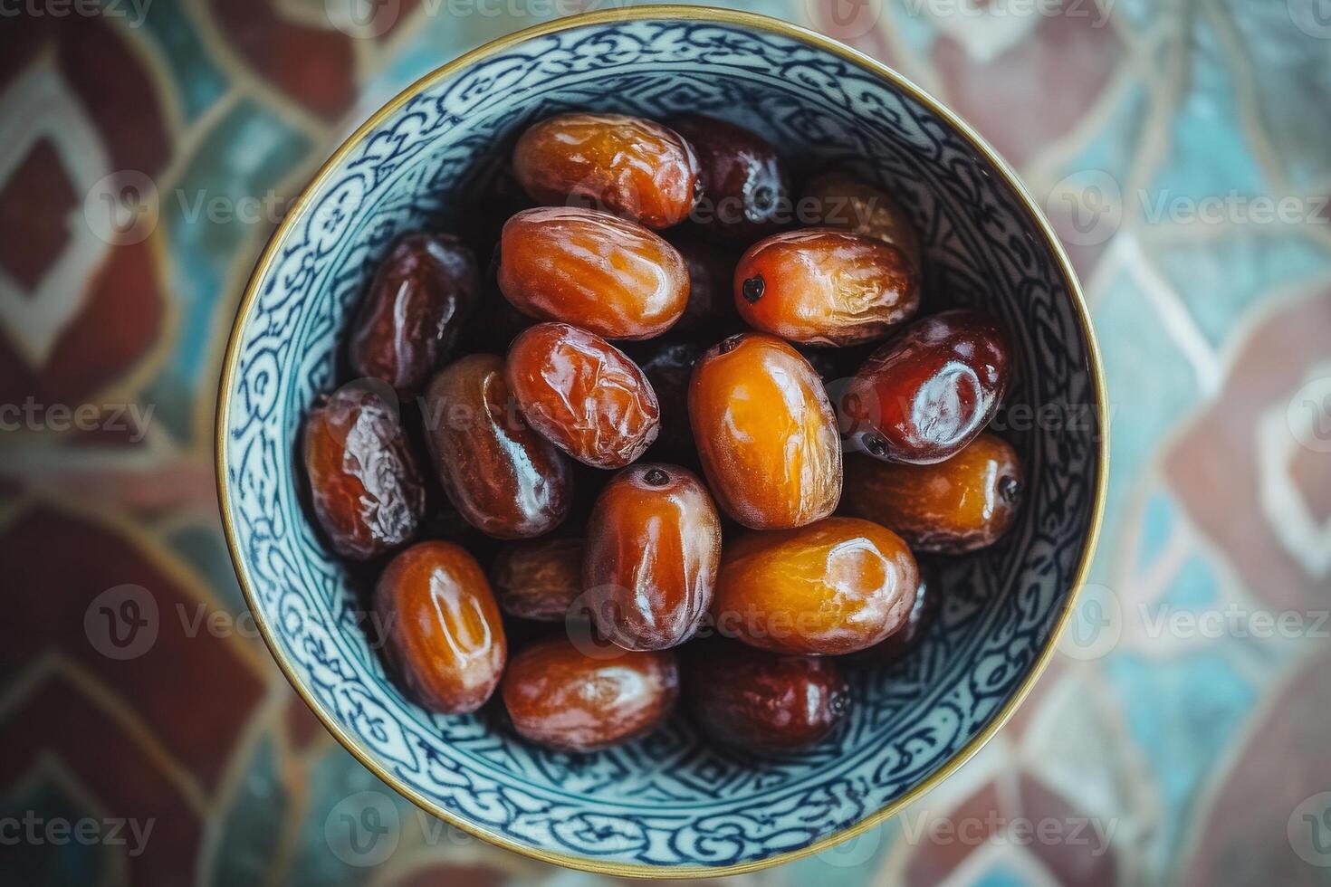 A bowl of dates on a table photo
