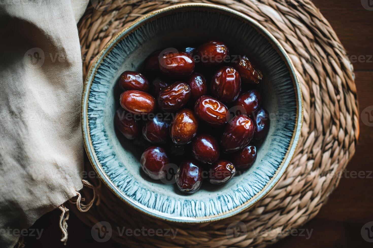 A bowl of dates on a table photo
