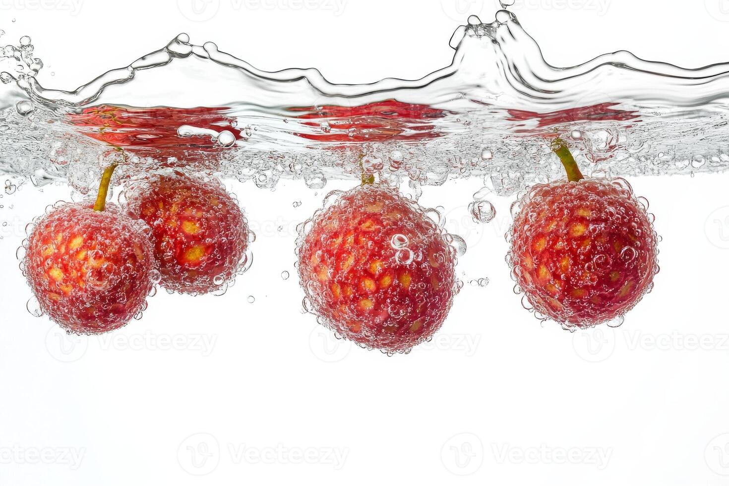 Fresh lychee fruit in water with bubbles photo