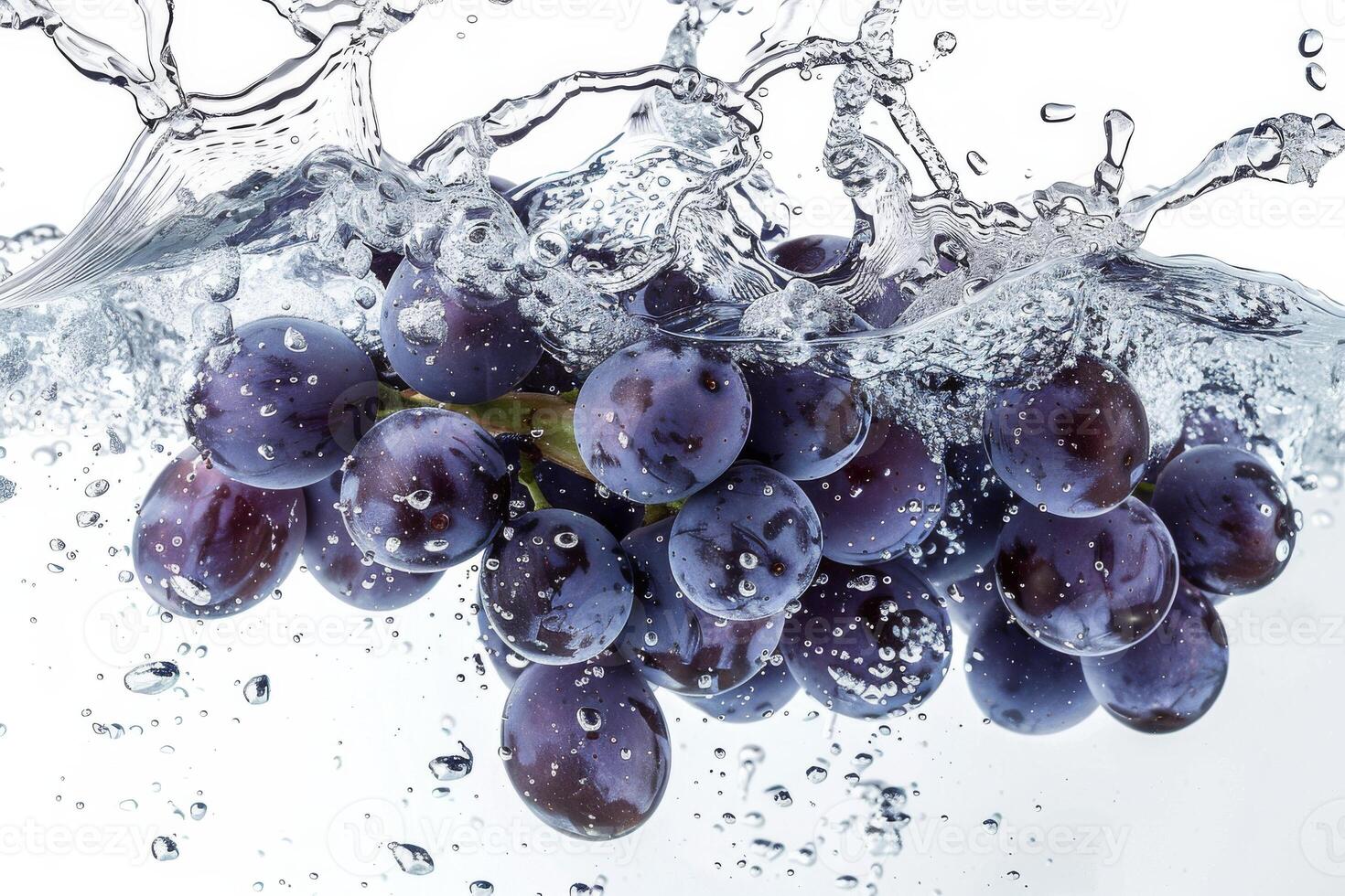 A bunch of grapes is being splashed into water photo