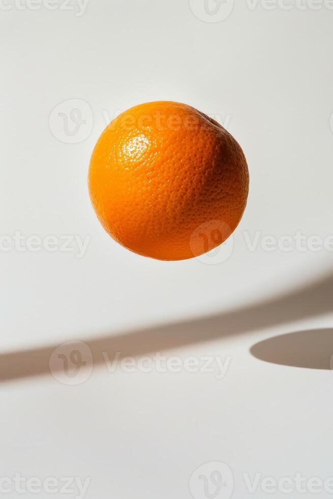 An orange is floating in the air photo