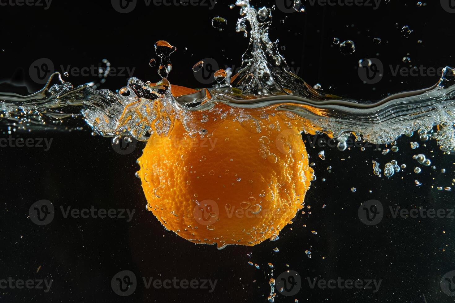 An orange being splashed in water photo
