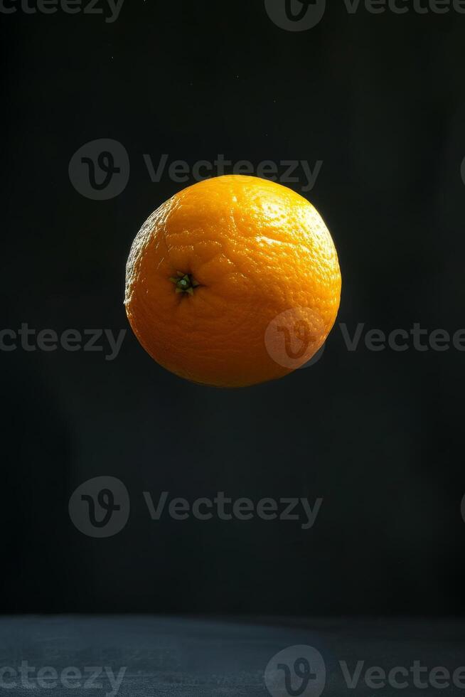 An orange floating in the air photo