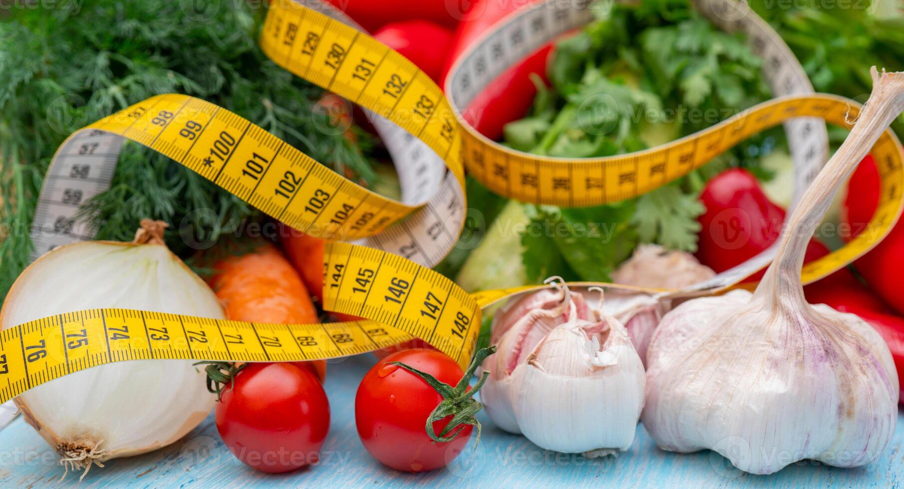 Measuring tape for measuring the circumference. Vegetables for diet cooking. photo