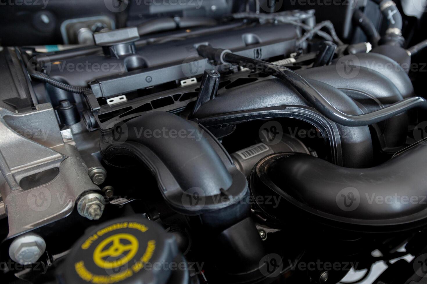 New car engine. Car hood open. Automotive industry. photo