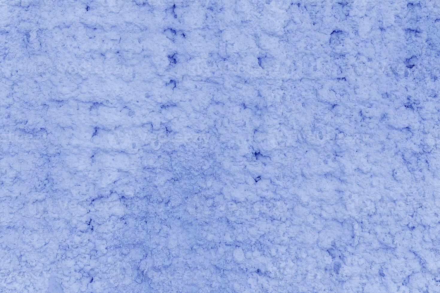 Texture of blue plaster. Rough wall of the building. photo
