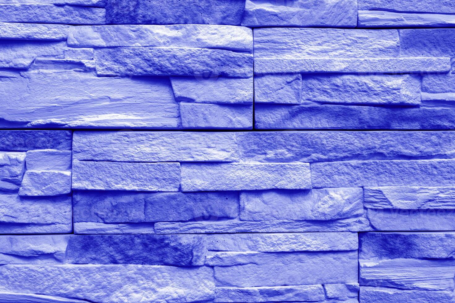 Blue stone wall of a building. Interior of a modern loft. Abstract background design. photo