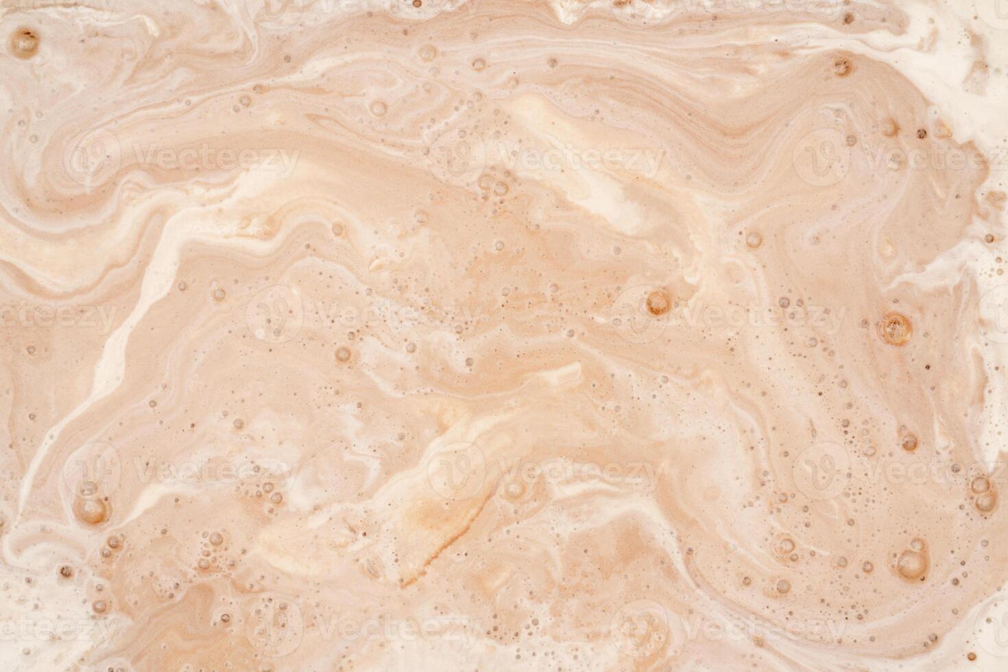Coffee with milk texture. View from above. Delicious sweet treat. photo