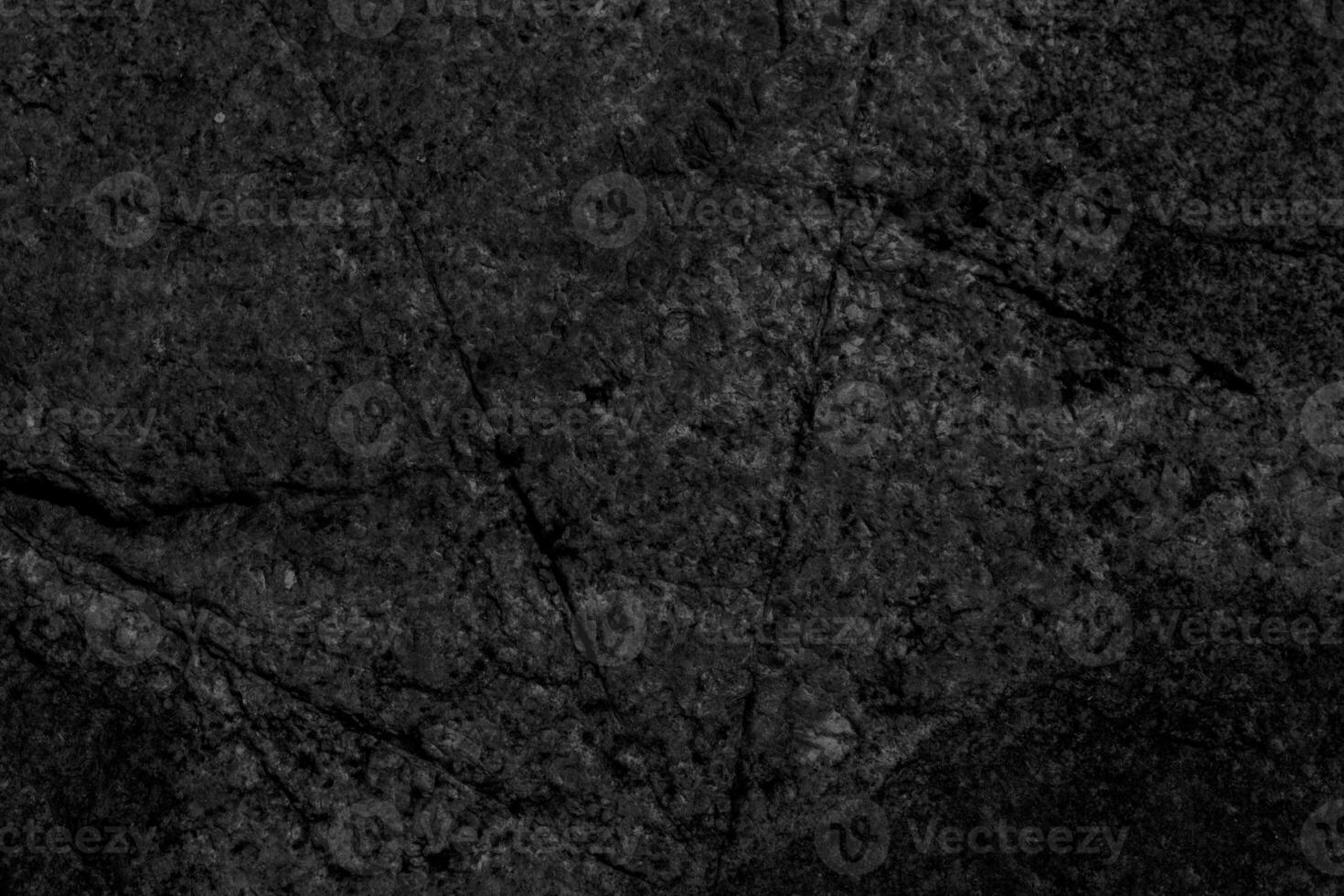 Cracked stone surface. The texture of granite. photo