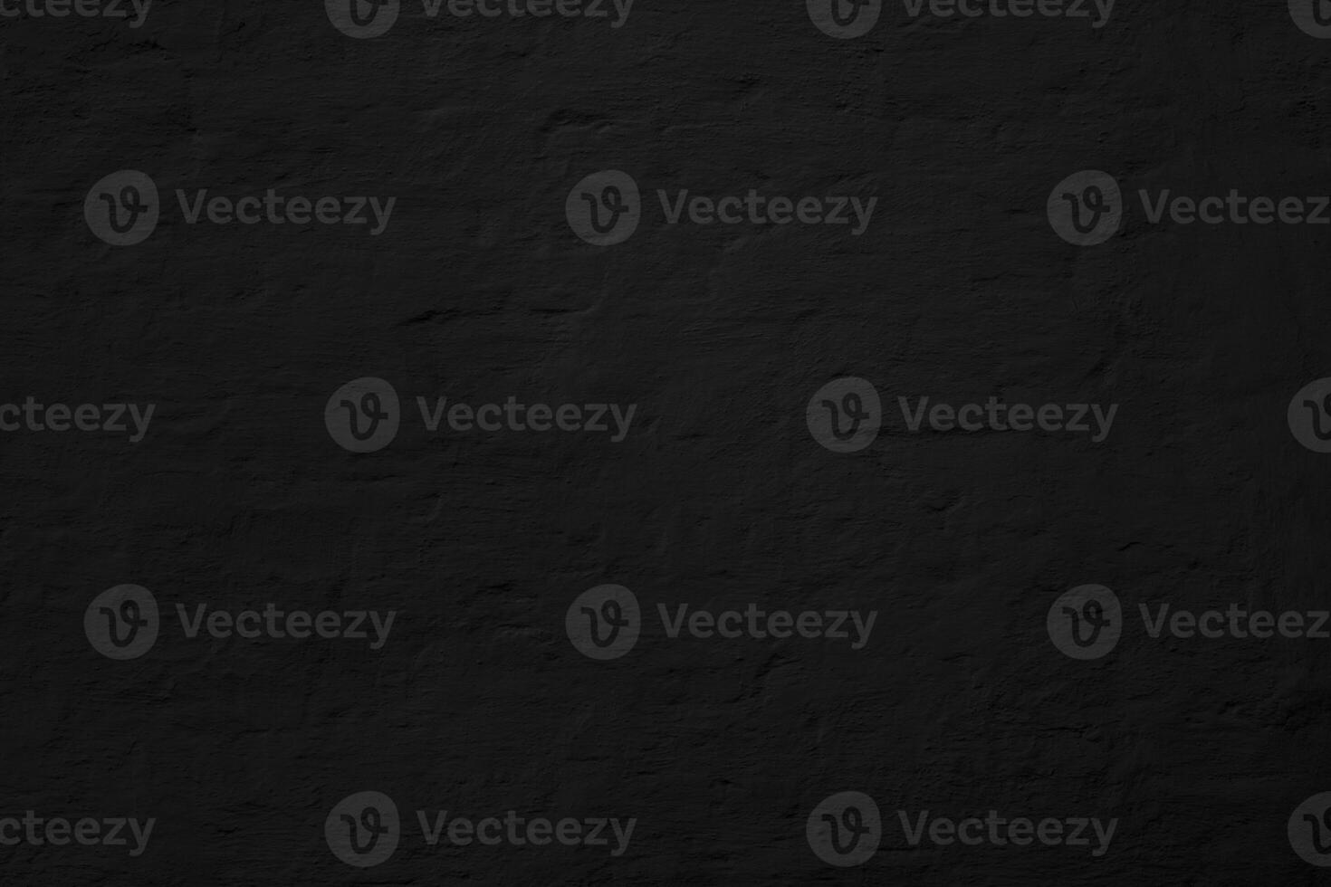Abstract black background. Black stucco texture. Dark rough surface. photo