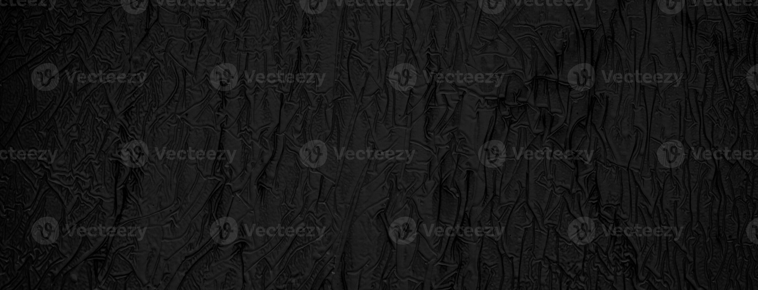 Texture of dried black paint. Abstract black background. photo