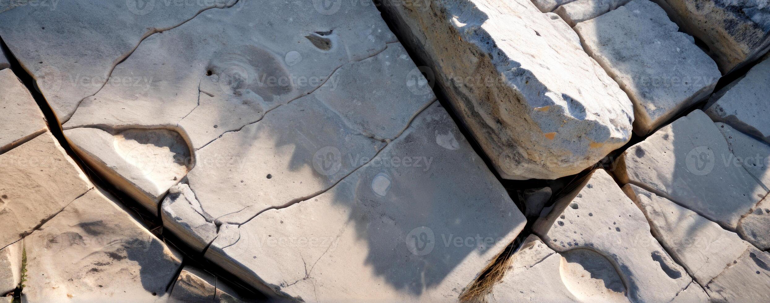 A close up of rocks with cracks in them photo