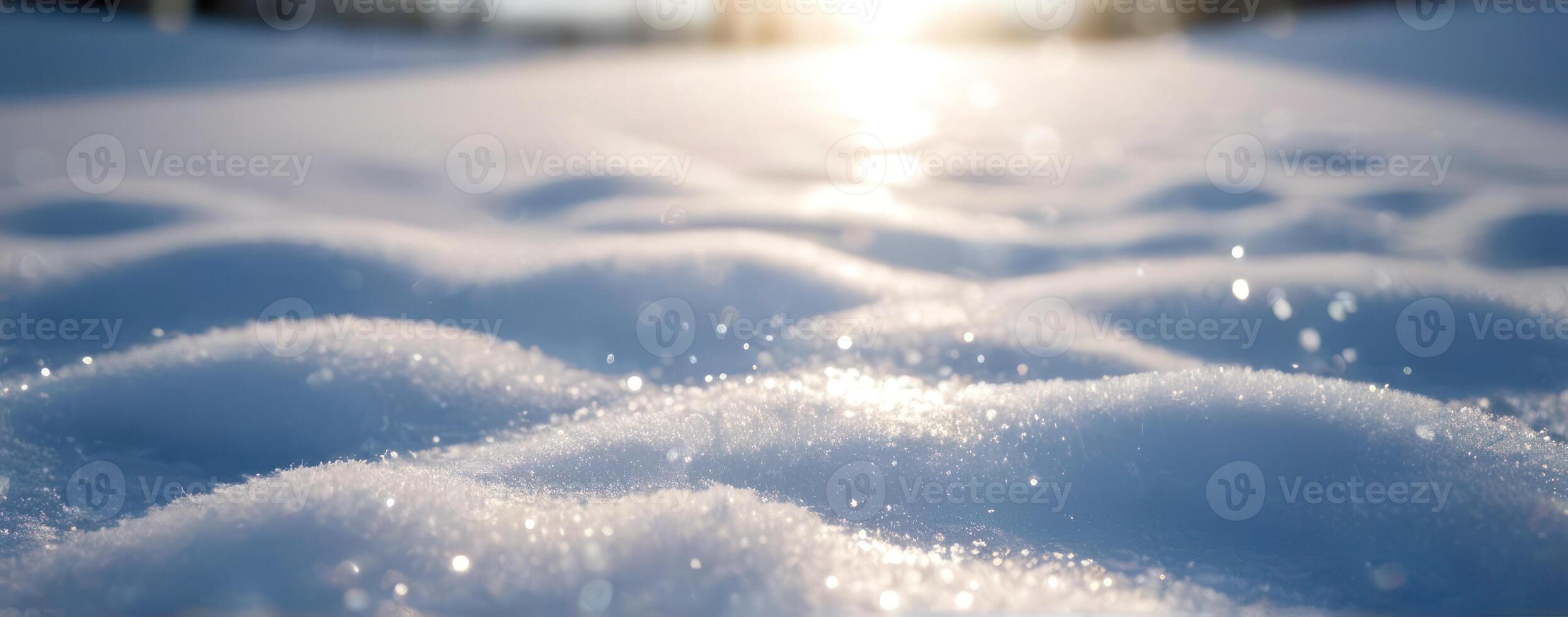 A close up of snow on the ground with the sun shining on it photo