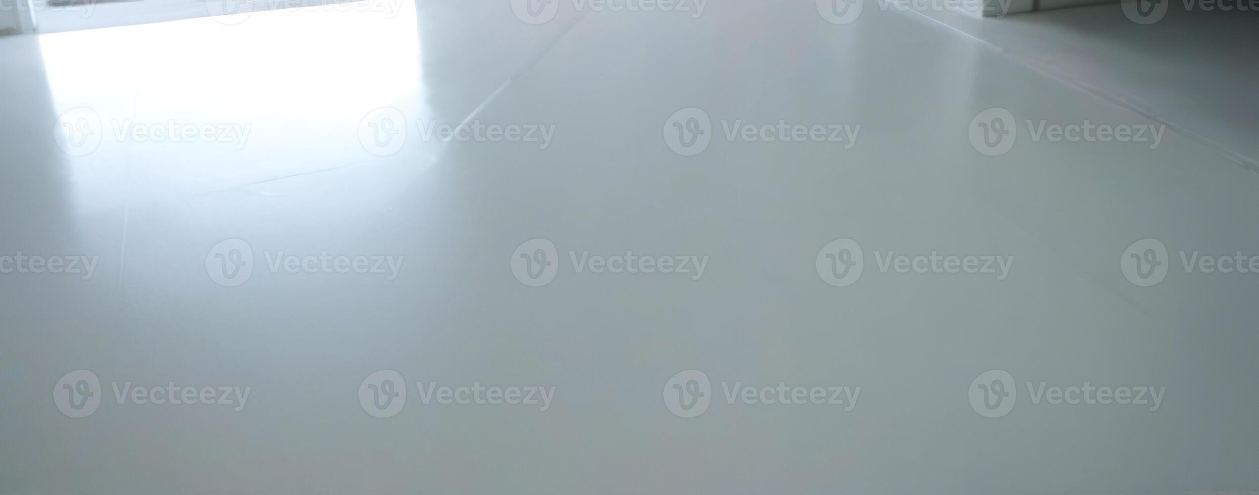 An image of a white floor in an empty room photo
