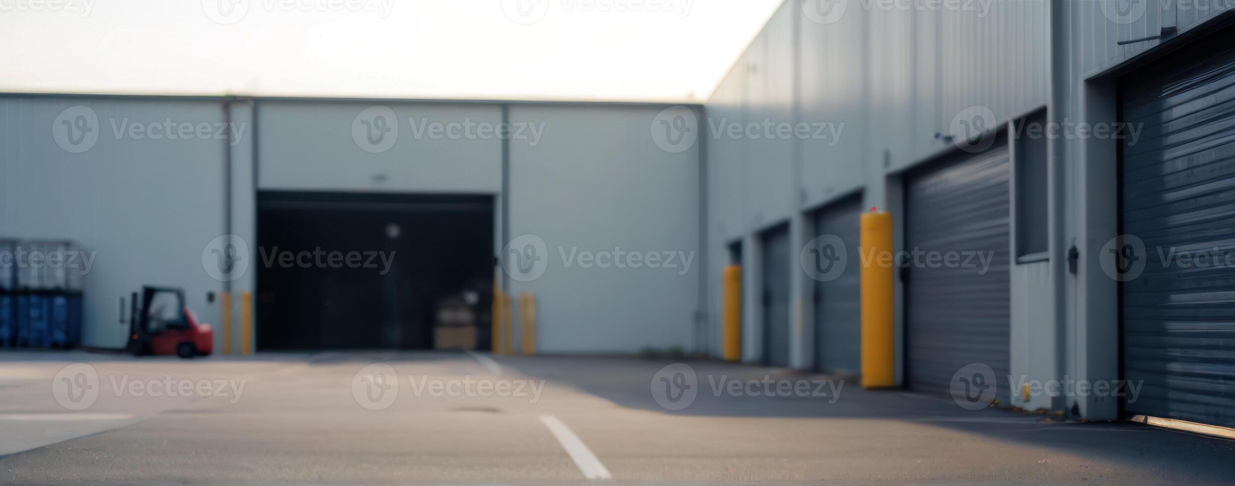 An empty warehouse with a forklift in the background photo
