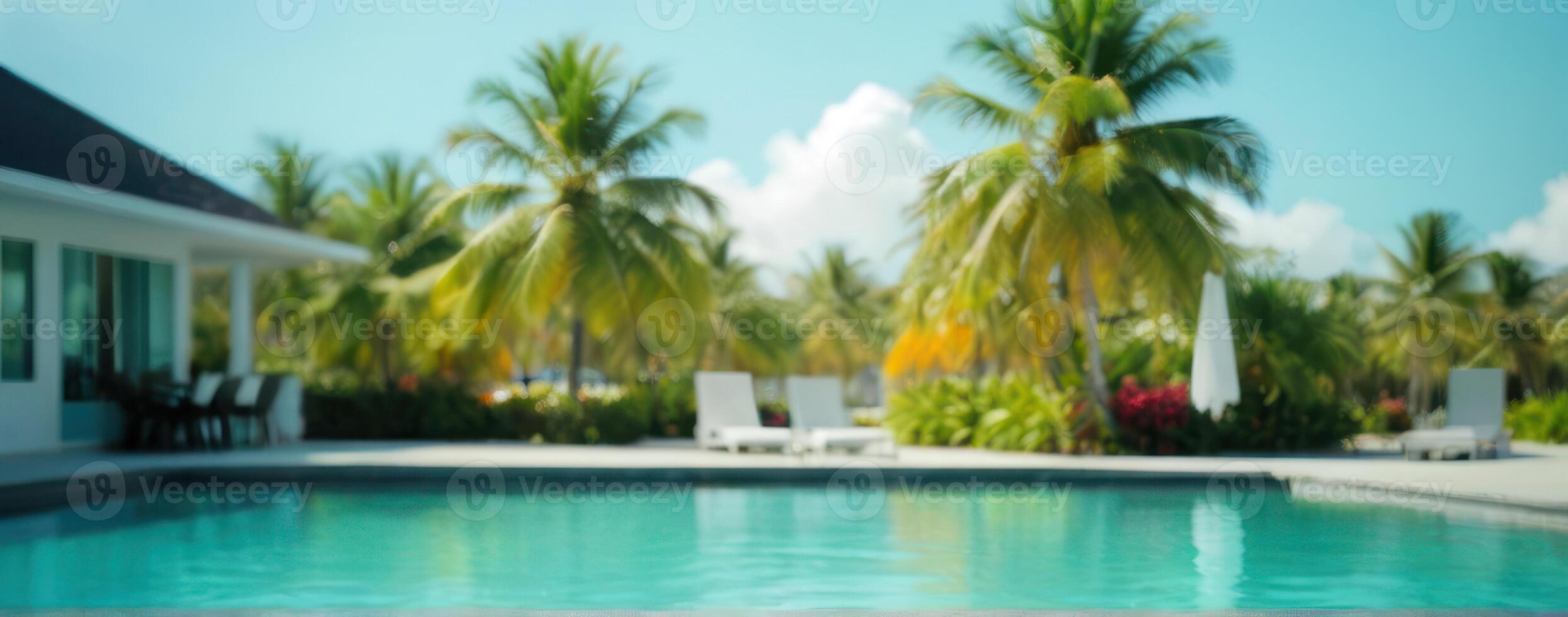 A swimming pool with palm trees in the background photo