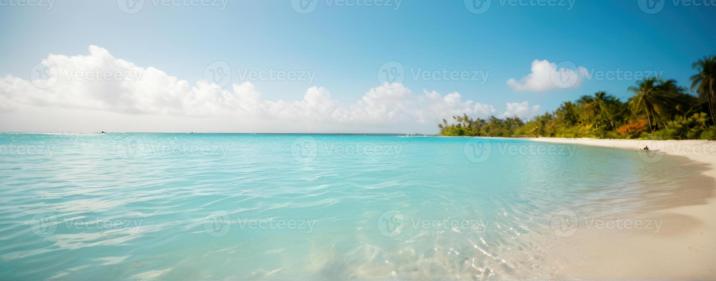 A beach with clear water and white sand photo
