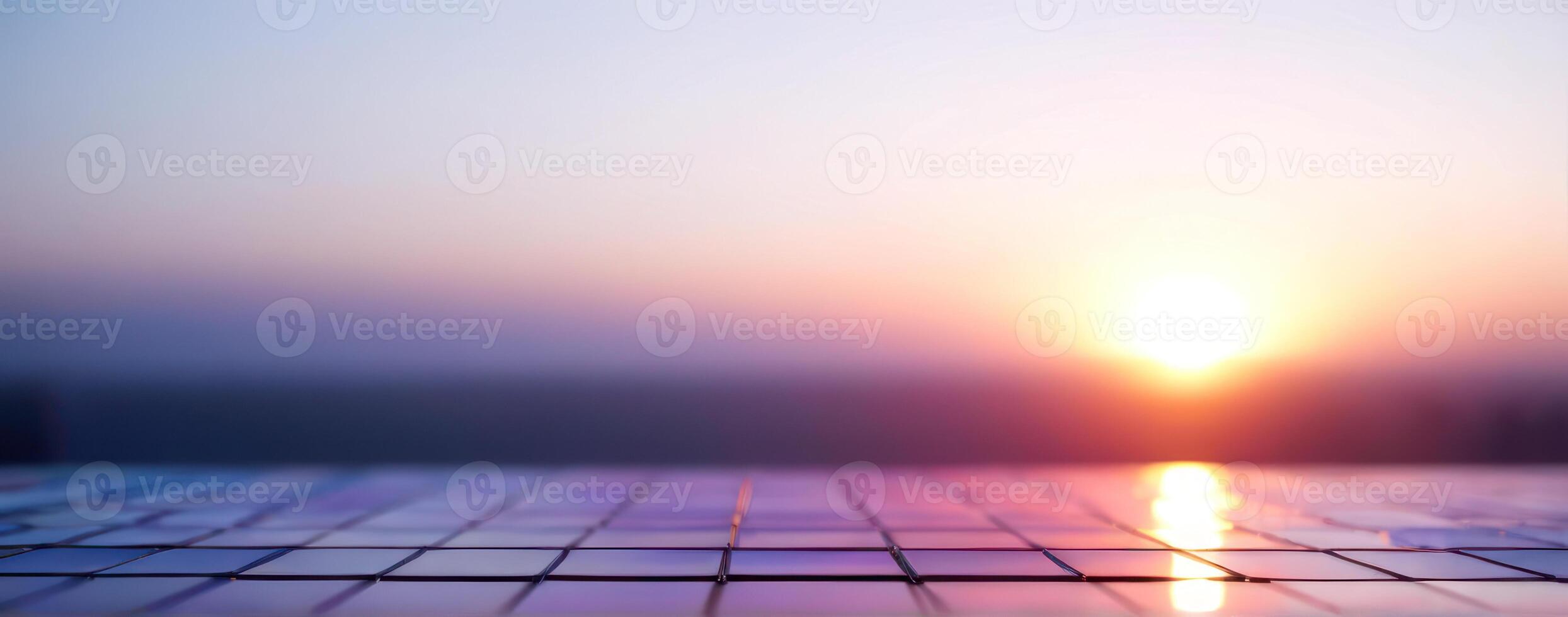 The sun is setting over a tiled floor photo