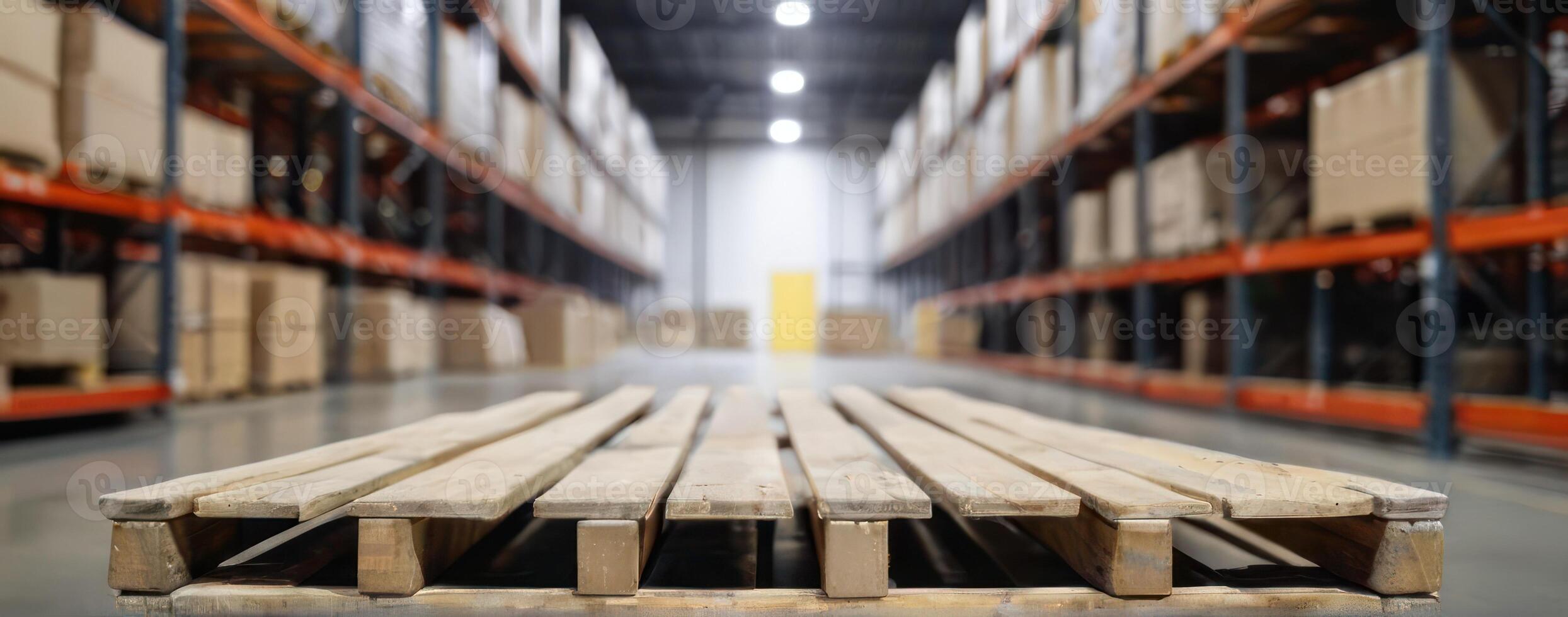 A warehouse with wooden pallets in the middle photo