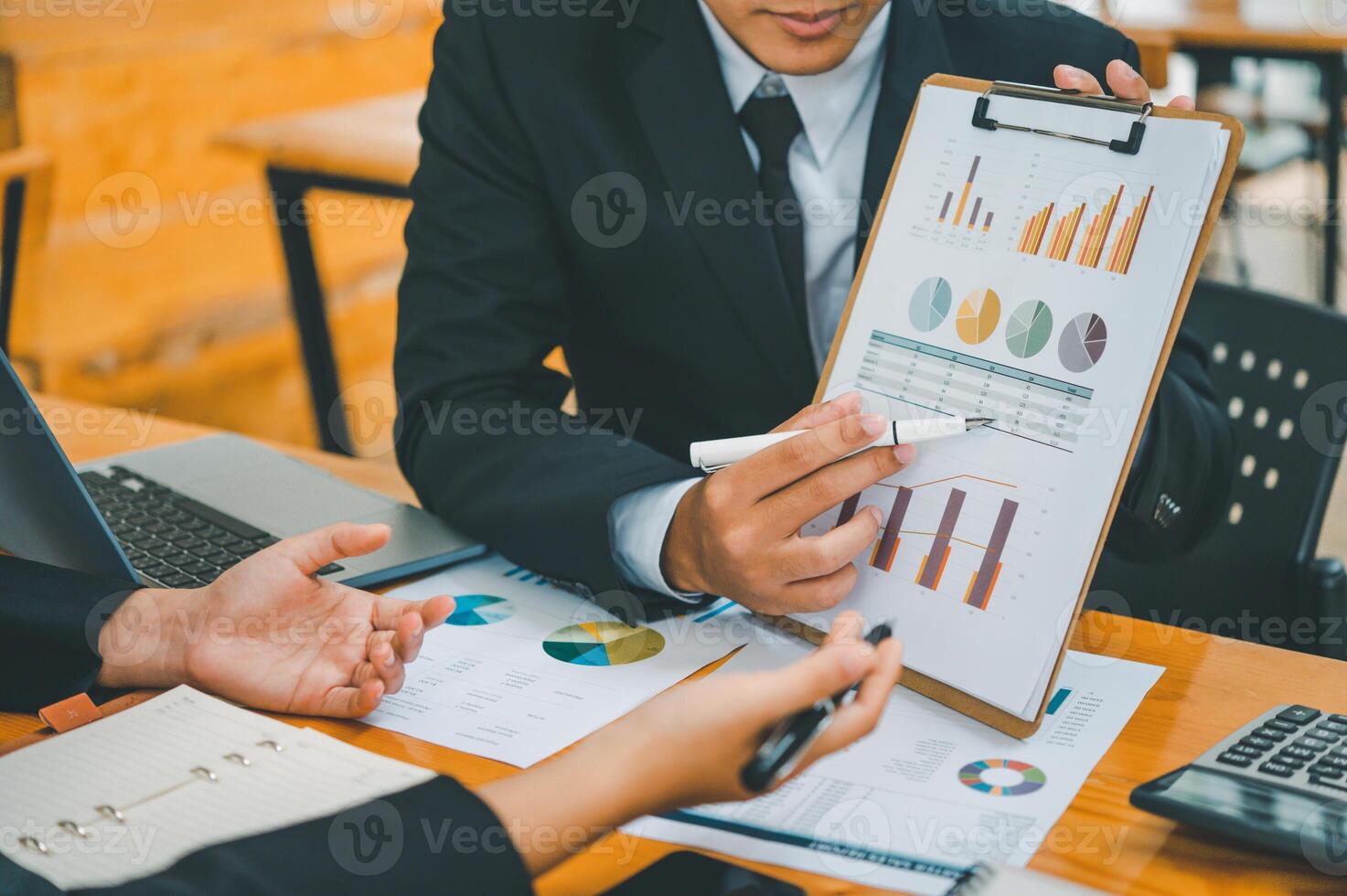 group of business people working and communicating together in the office With the charging of graphs for analysis, conceptual analysis and business planning photo