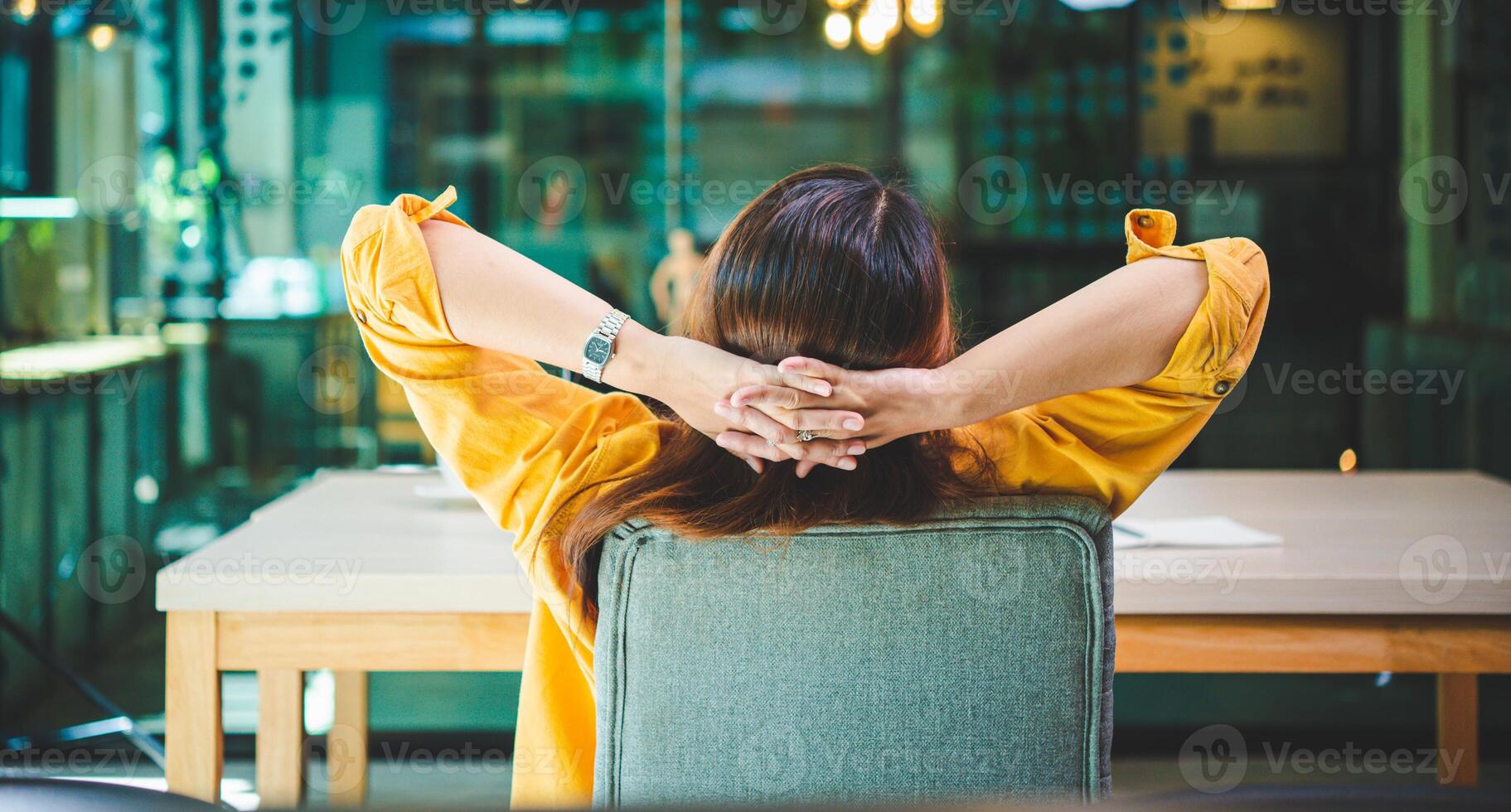 businesswoman is doing a relaxing pose to relieve fatigue after working for a long time. photo